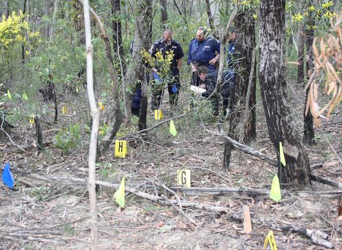 Police combed through the bushland after the discovery of remains on August 29, 2010. (AAP)