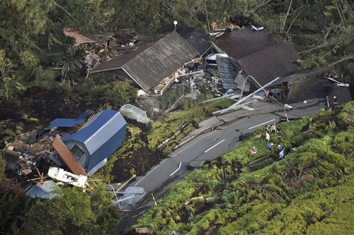 An aerial photo shows houses covered with landslides that seem to be happened by the earthquake in Atsuma Town, Hokkaido on Sep.6, 2018