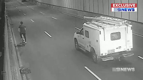 A French tourist was caught on CCTV riding a yellow hire-bike down a busy Sydney CBD tunnel. Picture: Supplied.