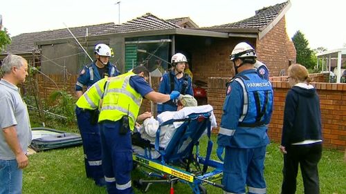 The man is assisted by paramedics. (9NEWS)