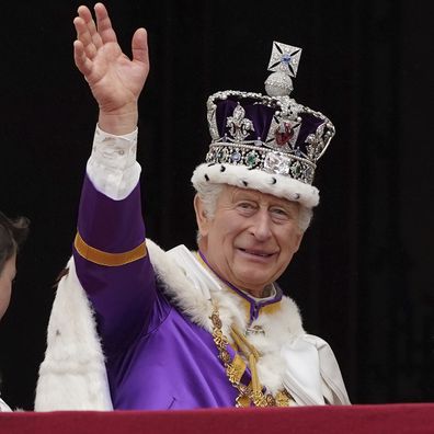 King Charles III waves from the balcony of Buckingham Palace, London, after the coronation ceremony of King Charles III and Queen Camilla, Saturday, May 6, 2023.
