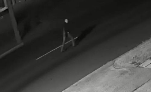 The man was captured on camera staggering more than 700 metres down the street, clenching his chest and gesturing to passing cars for help. (9NEWS)