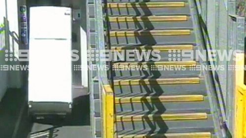 This commuter took a fridge on a train. (9NEWS)