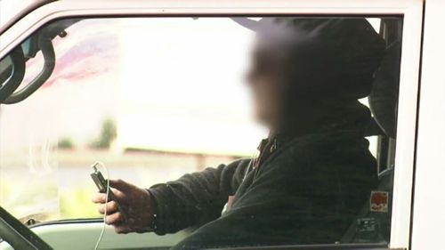 Drivers caught using their phones behind the wheel should face court, a former police officer has said.