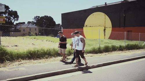 Kevin Hines walks with Joe Williams, a former NRL player and pro-boxer, in a scene from Suicide: The Ripple Effect (Supplied)