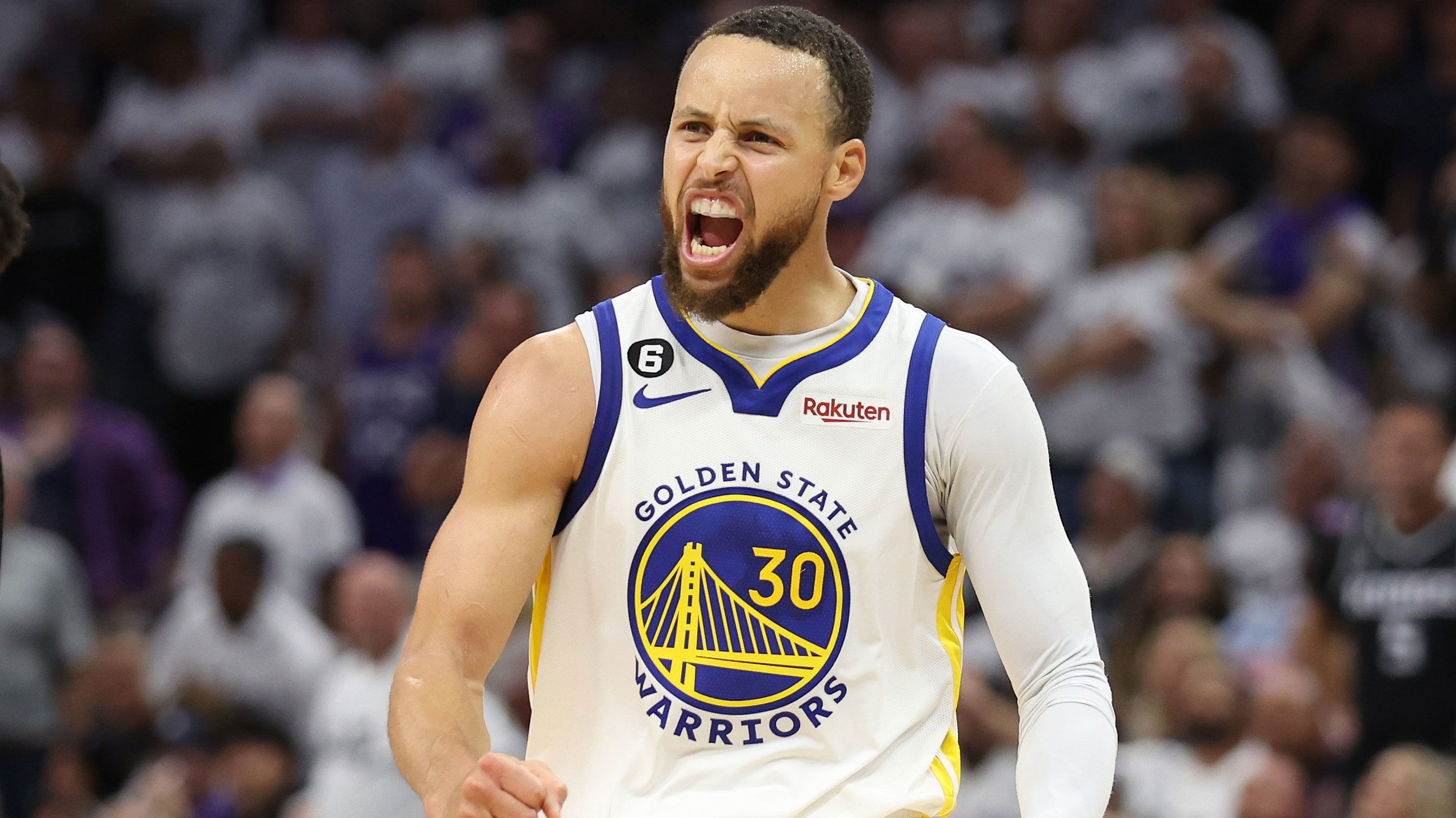 Stephen Curry #30 of the Golden State Warriors celebrates during the third quarter in game seven of the Western Conference playoffs against the Sacramento Kings.
