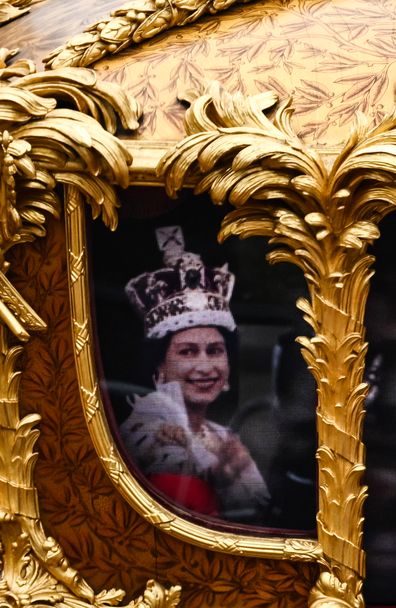 A hologram of Queen Elizabeth II during her coronation is projected in the Gold State Coach as it passes in front of Buckingham Palace during the Platinum Jubilee Pageant in front of Buckingham Palace, on day four of the Platinum Jubilee celebrations on June 05, 2022 in London, England. 