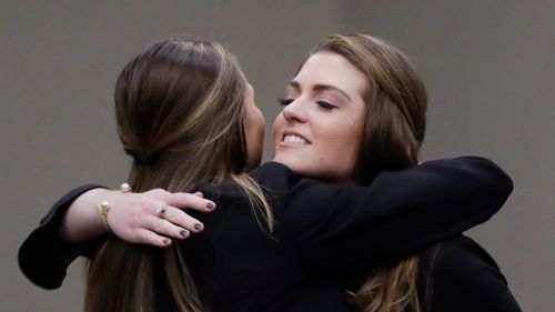 Sterling Riethman, right, is hugged after giving her victim impact statement. (AAP)