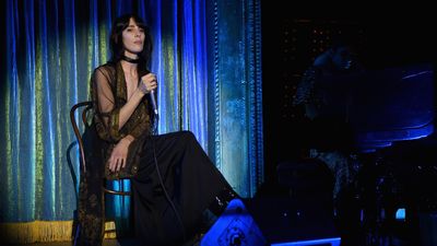 <p>Model and musician Jamie Bochert, who walked in the Marc Jacobs Resort show just last week, performs for guests.</p>