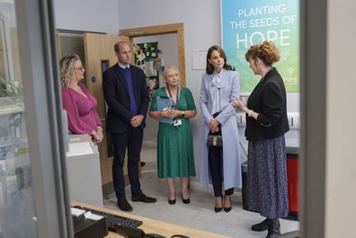 Prince William, Prince of Wales (second left) and Catherine, Princess of Wales (second right) speak with staff and counsellors during their visit to the PIPS (Public Initiative for Prevention of Suicide and Self Harm) charity on October 06, 2022 in Belfast, Northern Ireland 