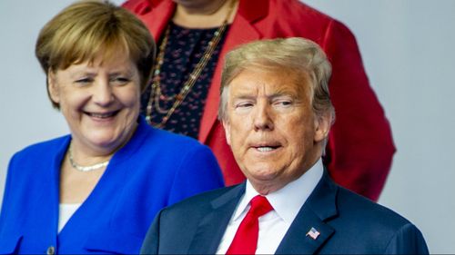 Mr Trump with German Chancellor Angela Merkel. (AAP)