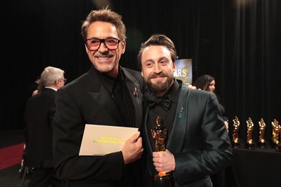 HOLLYWOOD, CALIFORNIA - MARCH 02:  In this handout photo provided by The Academy, Robert Downey and Kieran Culkin poses backstage during the 97th Annual Oscars at Dolby Theatre on March 02, 2025 in Hollywood, California.  (Photo by Al Seib/The Academy via Getty Images)