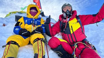 A photo of Grace Tseng and one of the Sherpas who helped her reach the summit of Manaslu in Nepal.