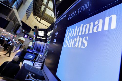 The logo for Goldman Sachs appears above a trading post on the floor of the New York Stock Exchange. (AP Photo/Richard Drew, File)