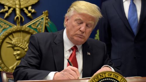 Mr Trump signed the "extreme vetting" executive order on Friday. (AFP)