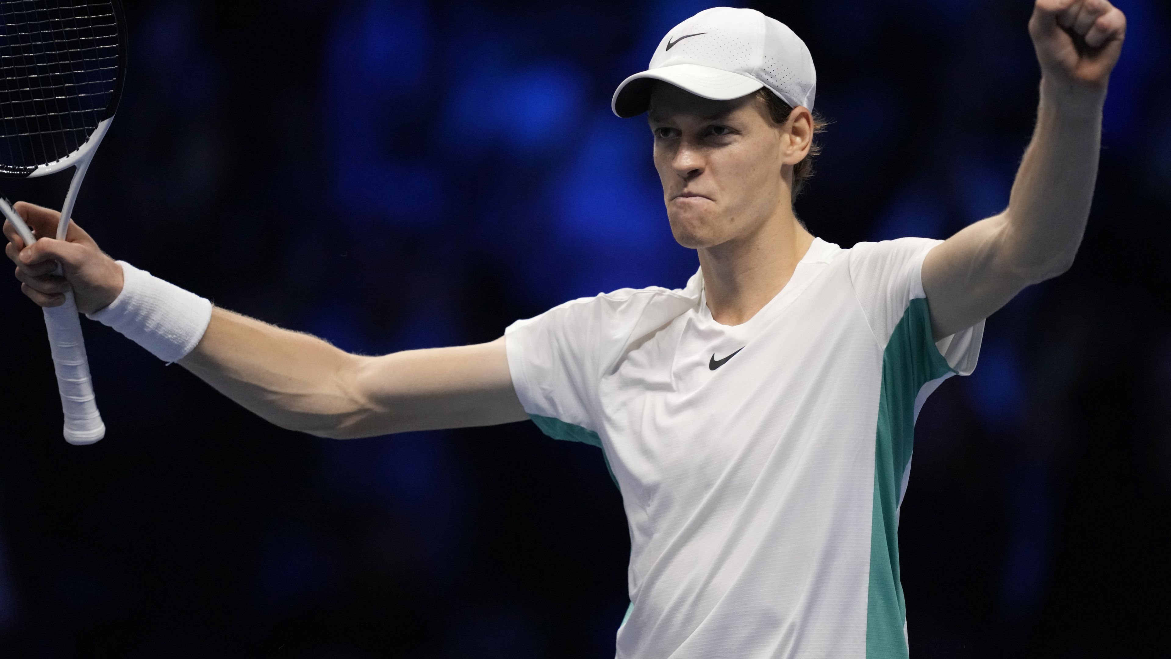 Italy&#x27;s Jannik Sinner celebrates beating Novak Djokovic.