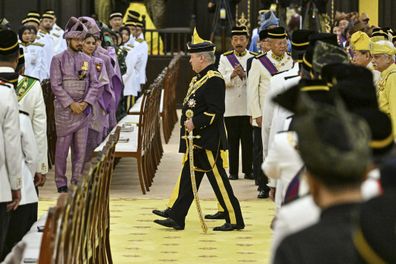 Sultan Ibrahim Sultan Iskandar, center, arrives for the oath taking ceremony as the Malaysias 17th king at the National Palace in Kuala Lumpur in Kuala Lumpur, Malaysia Wednesday, Jan. 31, 2024.  
