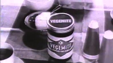 A vintage shot of Vegemite shows the spread next to the salt and pepper