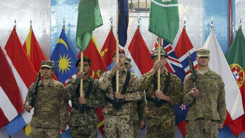 NATO ends Afghanistan war but troops will remain in country