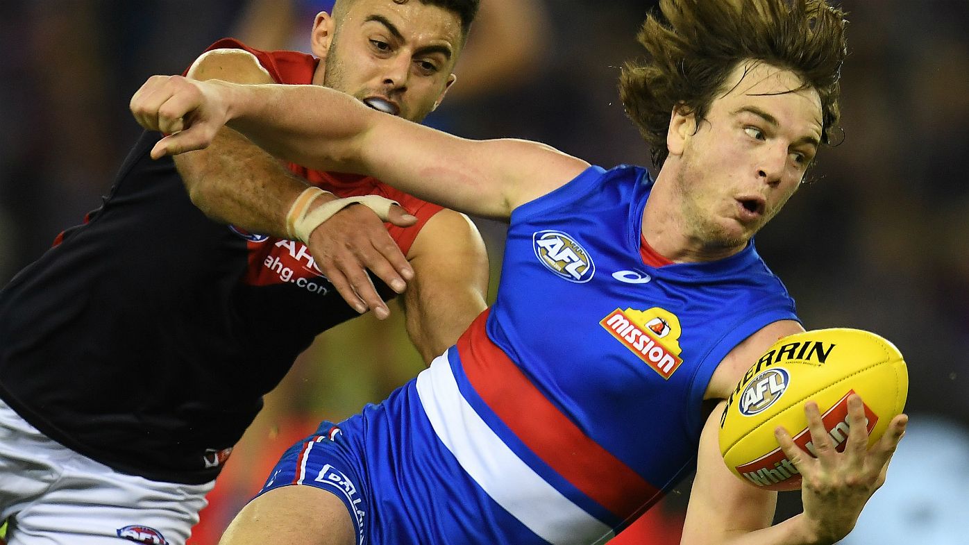 Christian Salem of the Demons (left) and Liam Picken of the Bulldogs contest during the Round 13 AFL match between the Western Bulldogs and the Melbourne Demons at Etihad Stadium in Melbourne, Sunday, June 18, 2017