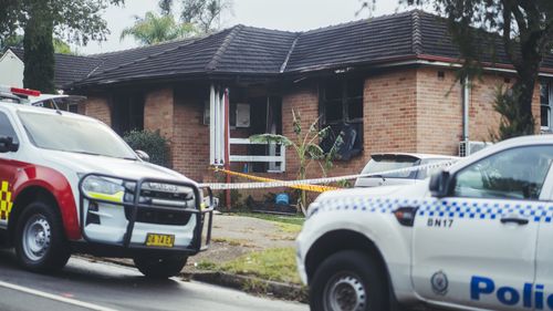 Three children have died and a man is in police custody after a house fire in Lalor Park.