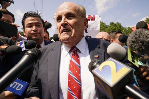 Rudy Giuliani speaks outside the Fulton County jail, Wednesday, Aug. 23, 2023, in Atlanta. 