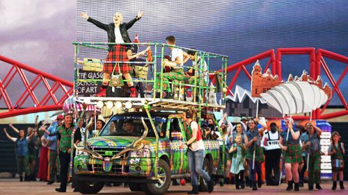 Karen Dunbar sings on top of a kitted-out truck. (Getty)