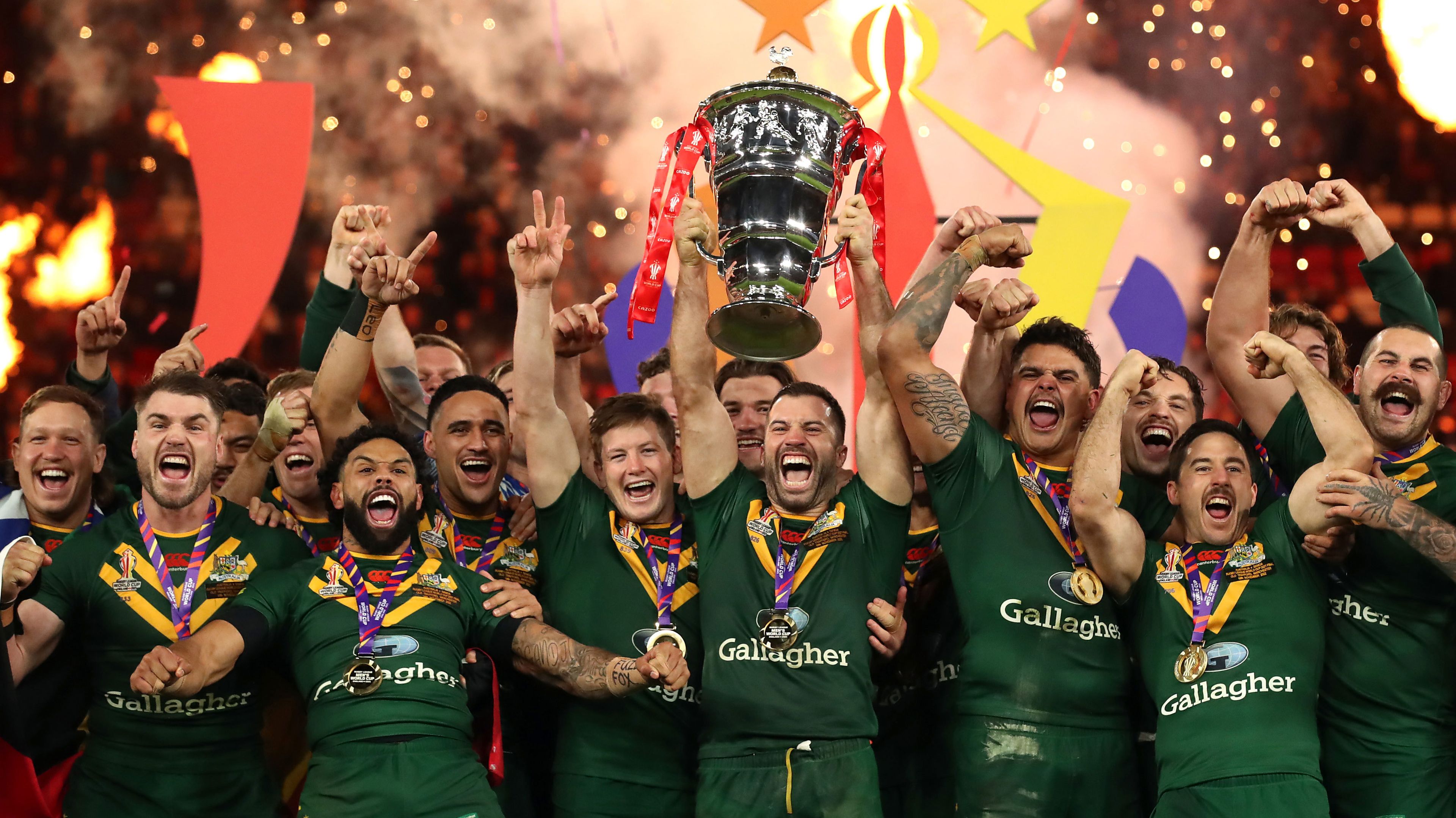 Kangaroos captain James Tedesco lifts the Rugby League World Cup trophy after Australia&#x27;s win over Samoa in the 2022 tournament final.