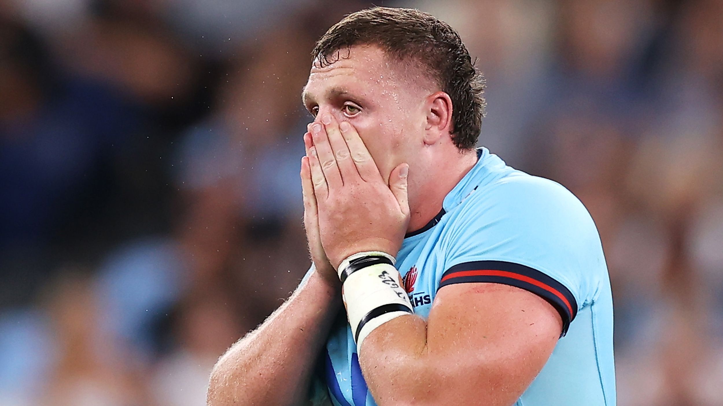 Angus Bell of the Waratahs reacts to his toe injury.