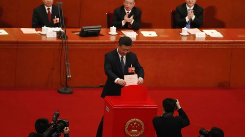 China's National People's Congress has passed constitutional changes that abolish term limits to let President Xi Jinping rule indefinitely. (PA/AAP)