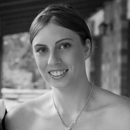 A woman found dead in a Gold Coast backyard with burns to her body has been identified as Kelly Wilkinson.