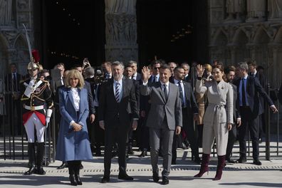 French President Emmanuel Macron, second right, and his wife Brigitte Macron, left, wave with King Frederik X of Denmark and Queen Mary of Denmark, right, after visiting Notre Dame cathedral, Wednesday, April 2, 2025 in Paris. (AP Photo/Thibault Camus, Pool)
