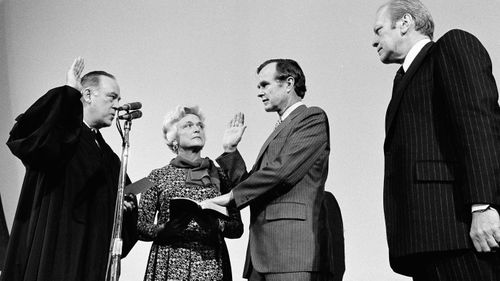 George H.W. Bush is sworn in as director of the Central Intelligence Agency by Supreme Court Associate Justice Potter Stewart, left, as Barbara Bush and President Gerald Ford, right, look on in 1976.