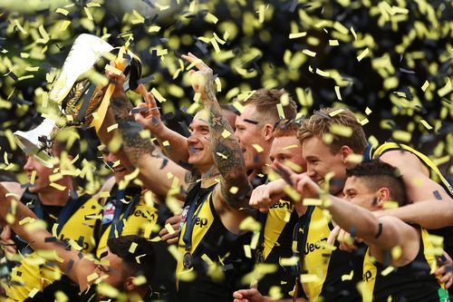 *APAC Sports Pictures of the Week - 2019, September 30* MELBOURNE, AUSTRALIA - SEPTEMBER 28: Dustin Martin of the Tigers holds aloft the Premiership Trophy after victory in the 2019 AFL Grand Final match between the Richmond Tigers and the Greater Western Sydney Giants at Melbourne Cricket Ground on September 28, 2019 in Melbourne, Australia. (Photo by Mark Metcalfe/AFL Photos/via Getty Images )