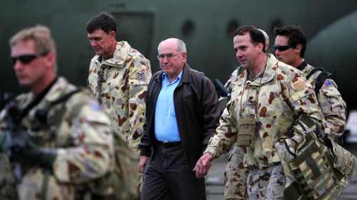 John Howard visiting troops in Afghanistan in 2005 when he was prime minister.