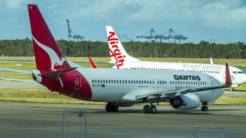 A Qantas and Virgin plane.