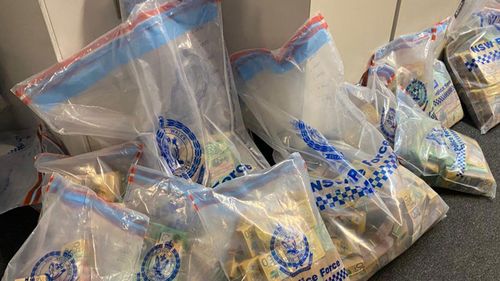 $4.7m cash was seized when police enetered a warehouse in a money laundering bust in Sydney's inner-south.