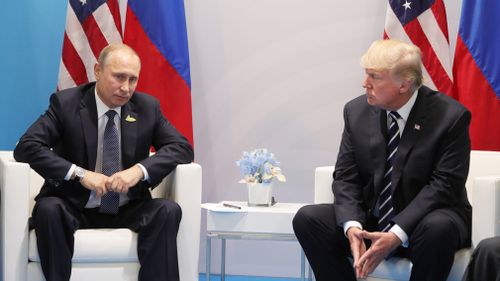 Russian President Vladimir Putin and President of the USA Donald Trump, right, talk during their meeting on the sidelines of the G20 summit in Hamburg. (AFP)