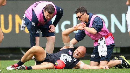 Chris Judd is injured during Saturday's game against Adelaide.