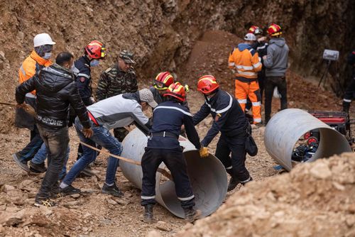 Moroccan emergency services teams work on the rescue of five-year-old boy Rayan from a well shaft he fell into on February 1, in the remote village of Ighrane in the rural northern province of Chefchaouen on February 5, 2022. - Moroccan rescuers worked through the night, the fifth day of an increasingly urgent and nerve-wracking effort to rescue Rayan, a five-year-old boy trapped underground in a well. (Photo by Fadel SENNA / AFP) (Photo by FADEL SENNA/AFP via Getty Images)