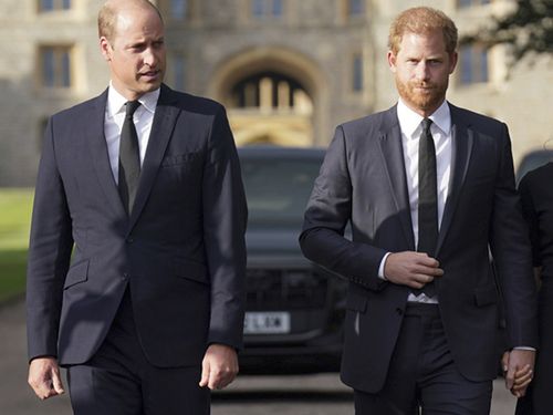 Prince William, Prince of Wales, left and Prince Harry walk to meet members of the public at Windsor Castle, following the death of Queen Elizabeth II on Thursday, in Windsor, England, Saturday, Sept. 10, 2022.