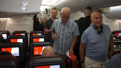 Passengers board the milestone flight. (9NEWS)