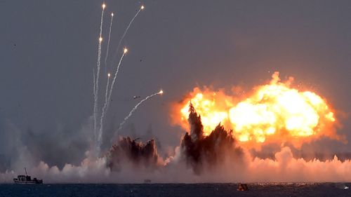 Russia's military jets and navy ships combine to light up the sky off the Crimean coast. Source: AFP