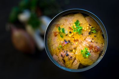 High angle view of canned tuna fish.