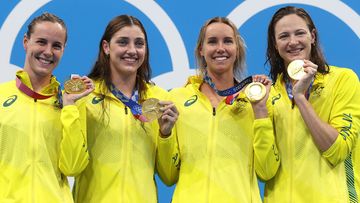 From left: Bronte Campbell, Meg Harris, Emma McKeon and Cate Campbell celebrate winning gold in the women&#x27;s 4x100m freestyle relay at the Tokyo 2021 Olympics.