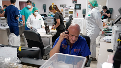 Dr. Joseph Varon notifies the family of a patient who died inside the Coronavirus Unit at United Memorial Medical Center, Monday, July 6, 2020, in Houston.