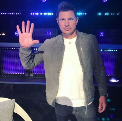 98 Degrees boyband star Nick Lachey has been charged after attacking a female photographer.