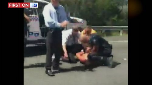 Mr Virzi was tackled by officers on the M1. (9NEWS)