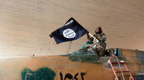 Islamic State fighter waving their flag