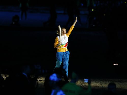 Sally Pearson carries the Queen's Baton. (AAP)